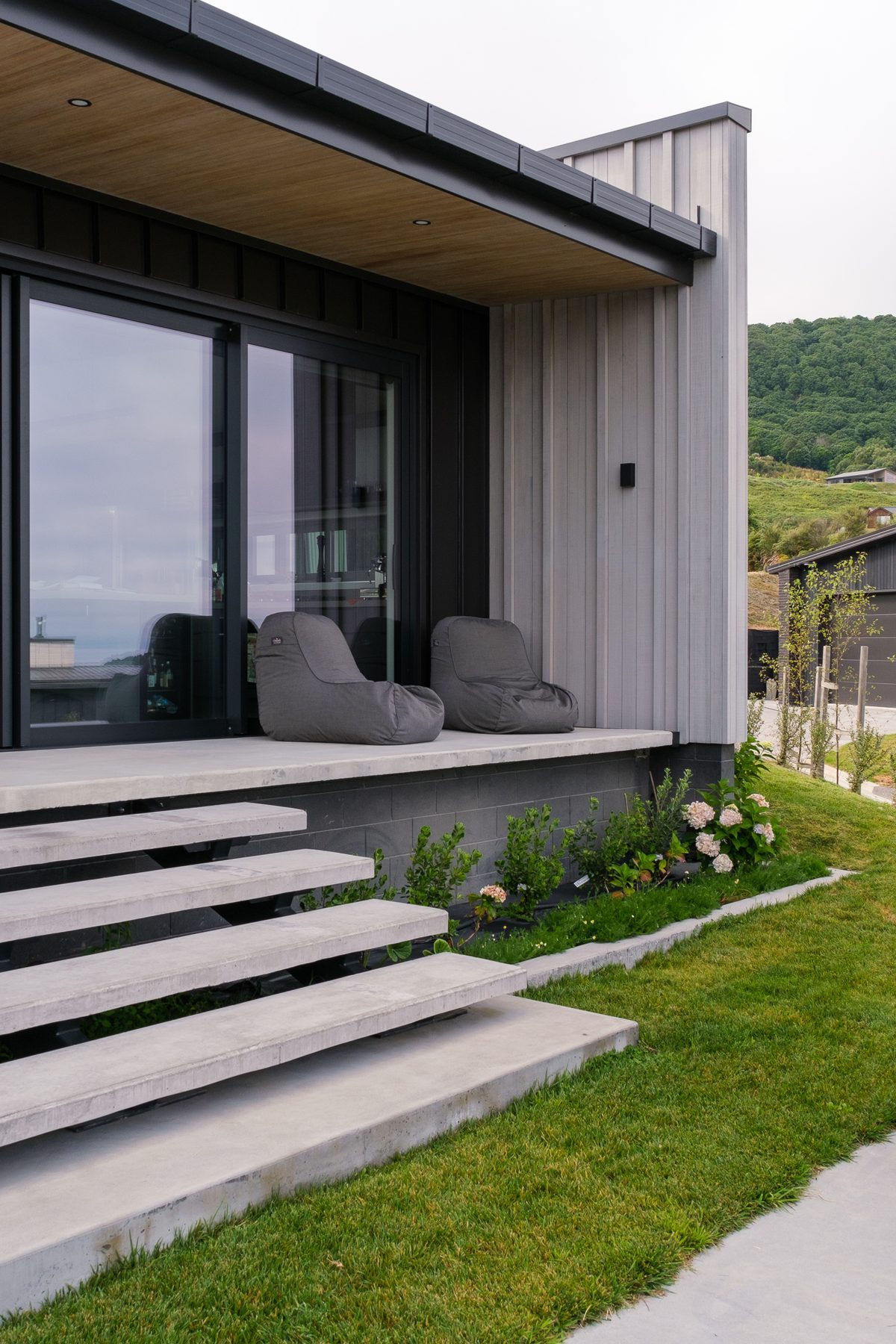 Floating concrete steps at the entrance.