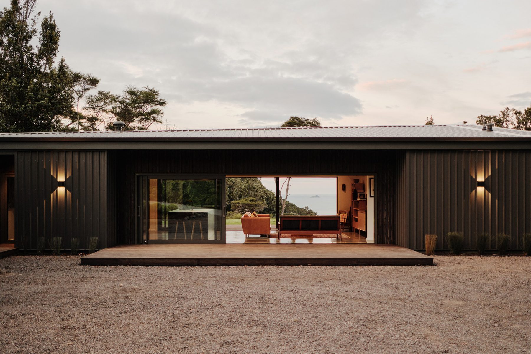 The front deck, living spaces open to the lawn.