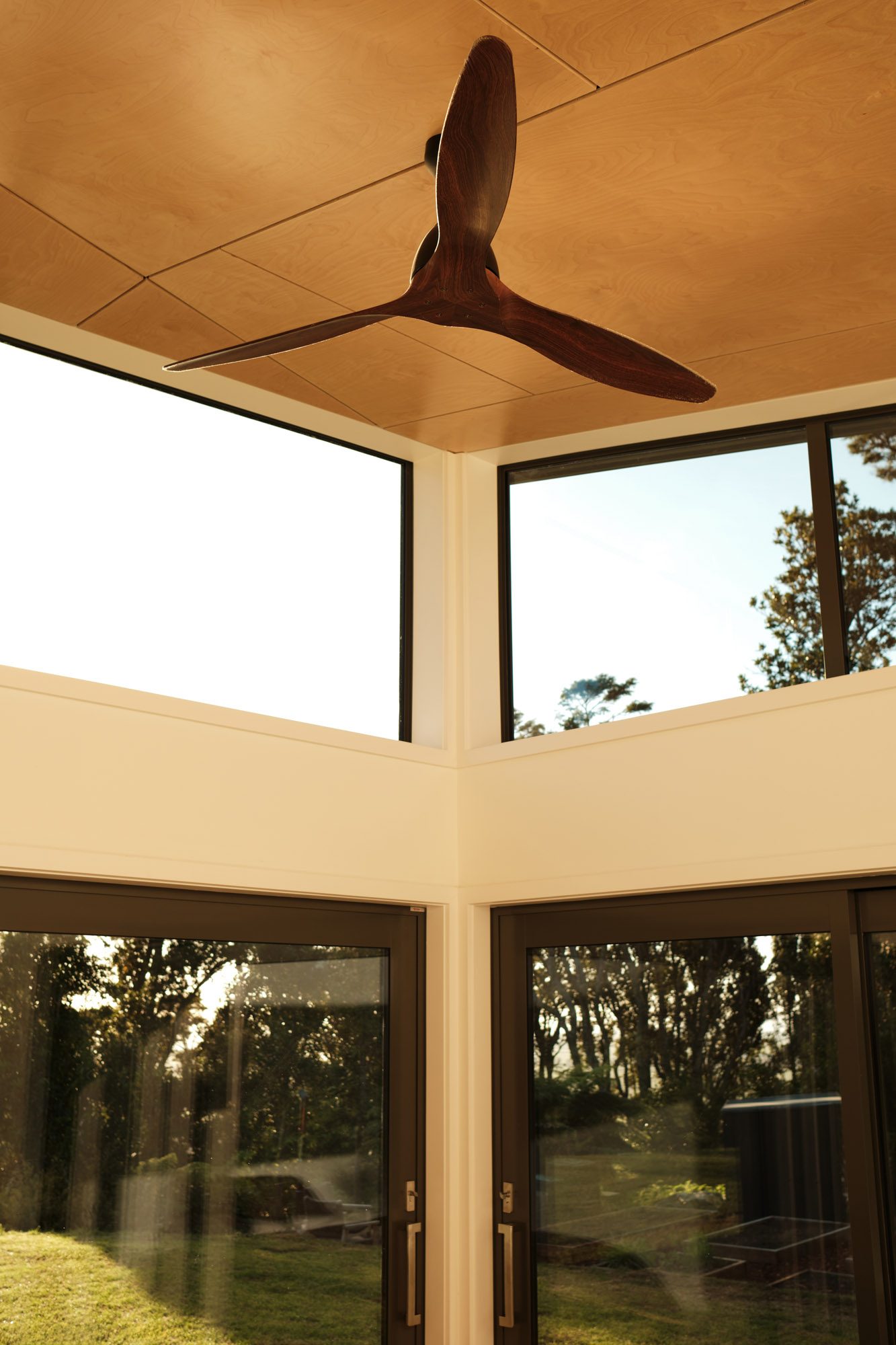 Interior: main bedroom clerestory windows and plywood ceiling