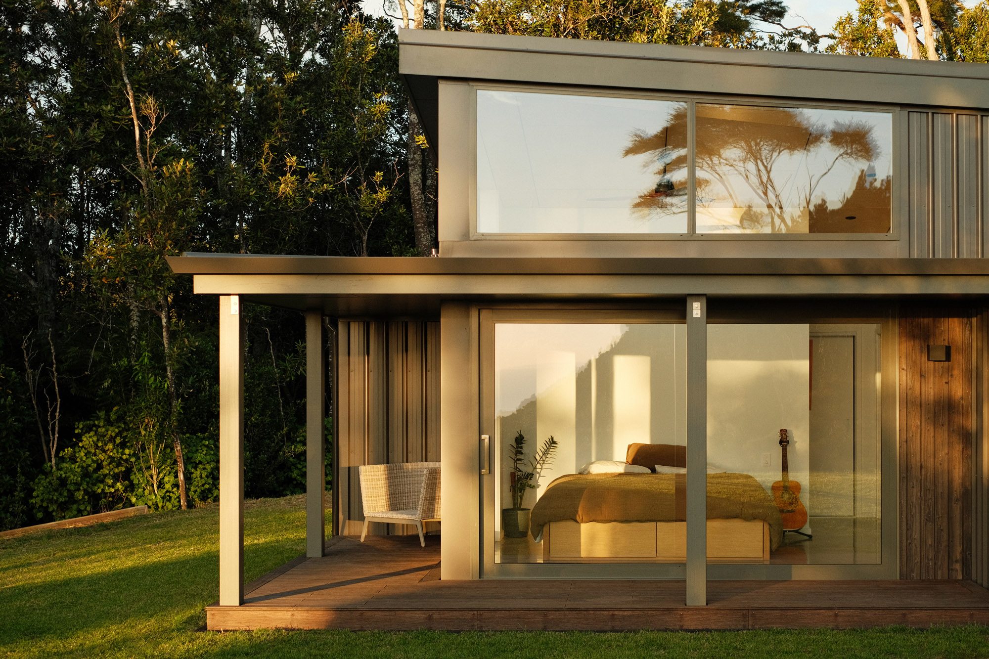 Exterior: Main bedroom sliding doors and clerestory windows in morning light