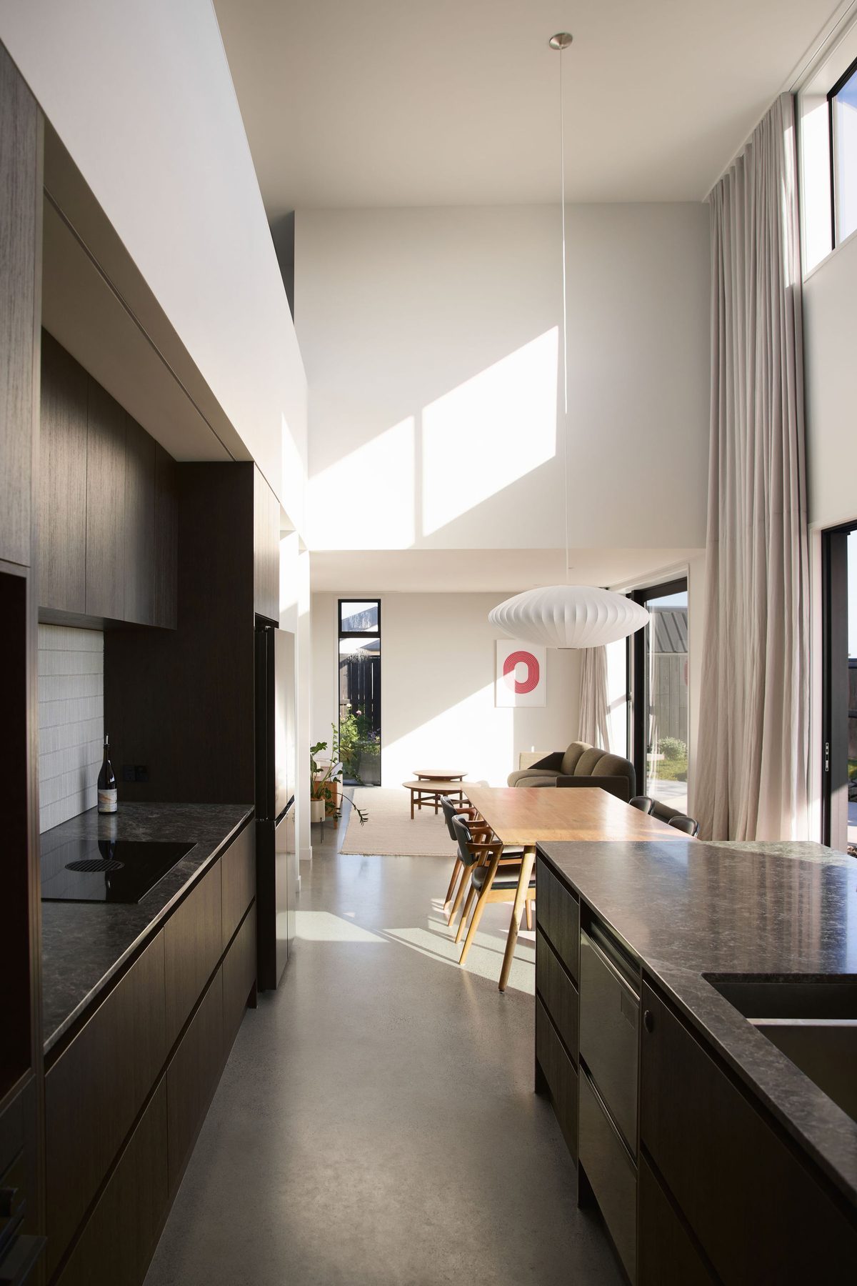 Kitchen towards the double-height dining space.