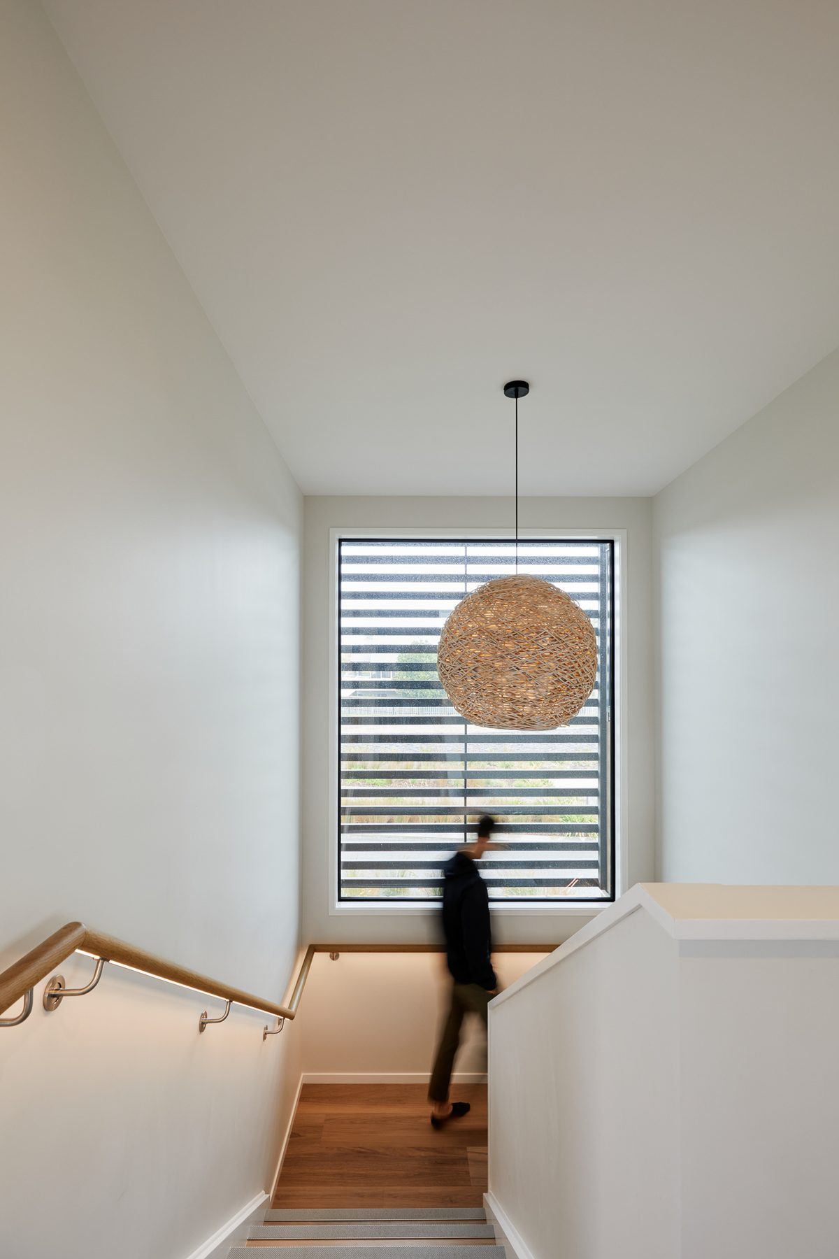 The stair, lit by its pendant.