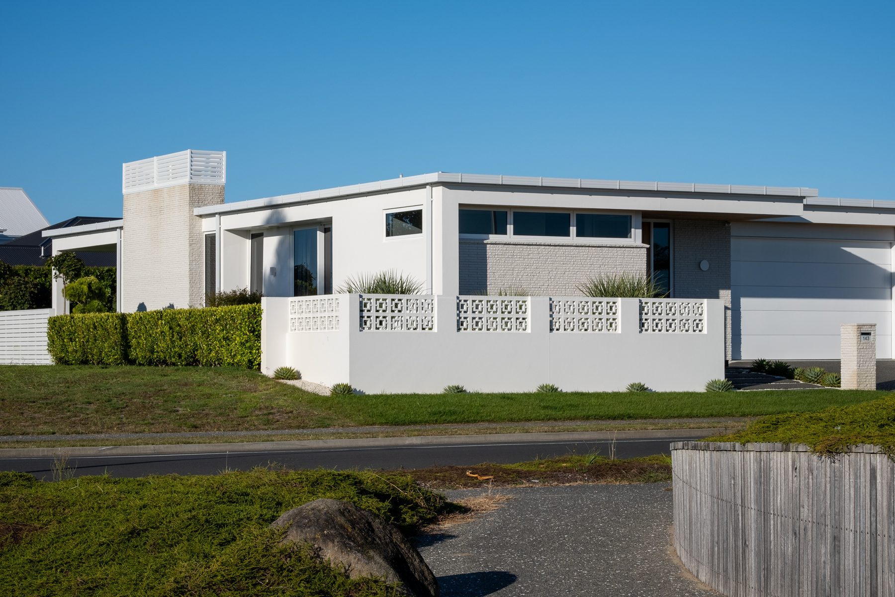 Mid-century lines along the street edge.