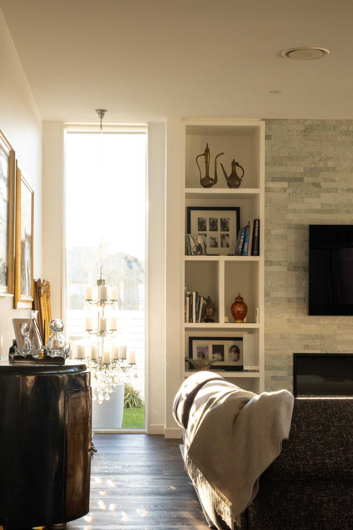 Living space framed by full-height windows.