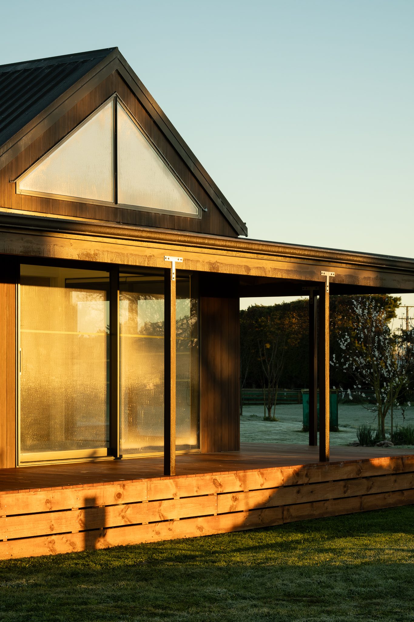 Main bedroom at sunrise with high glazing