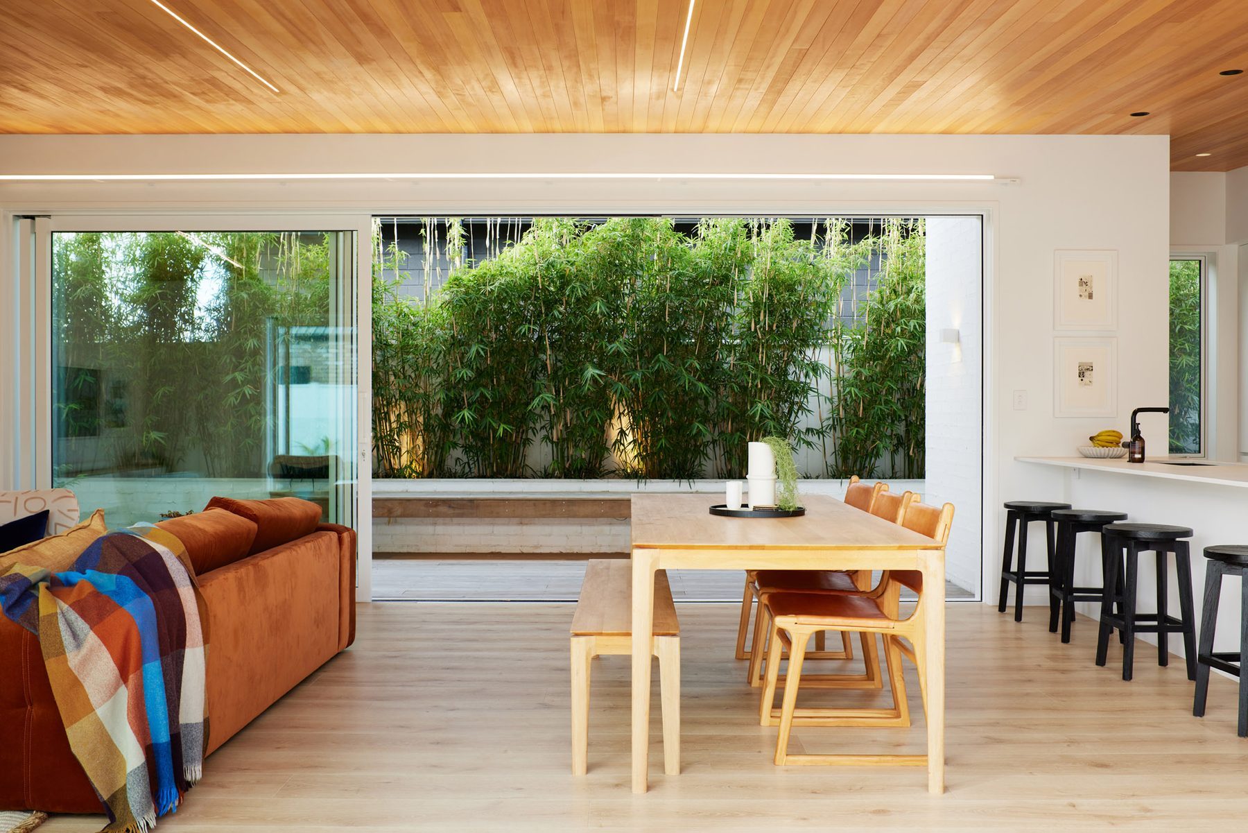 Open-plan dining opening to the courtyard.