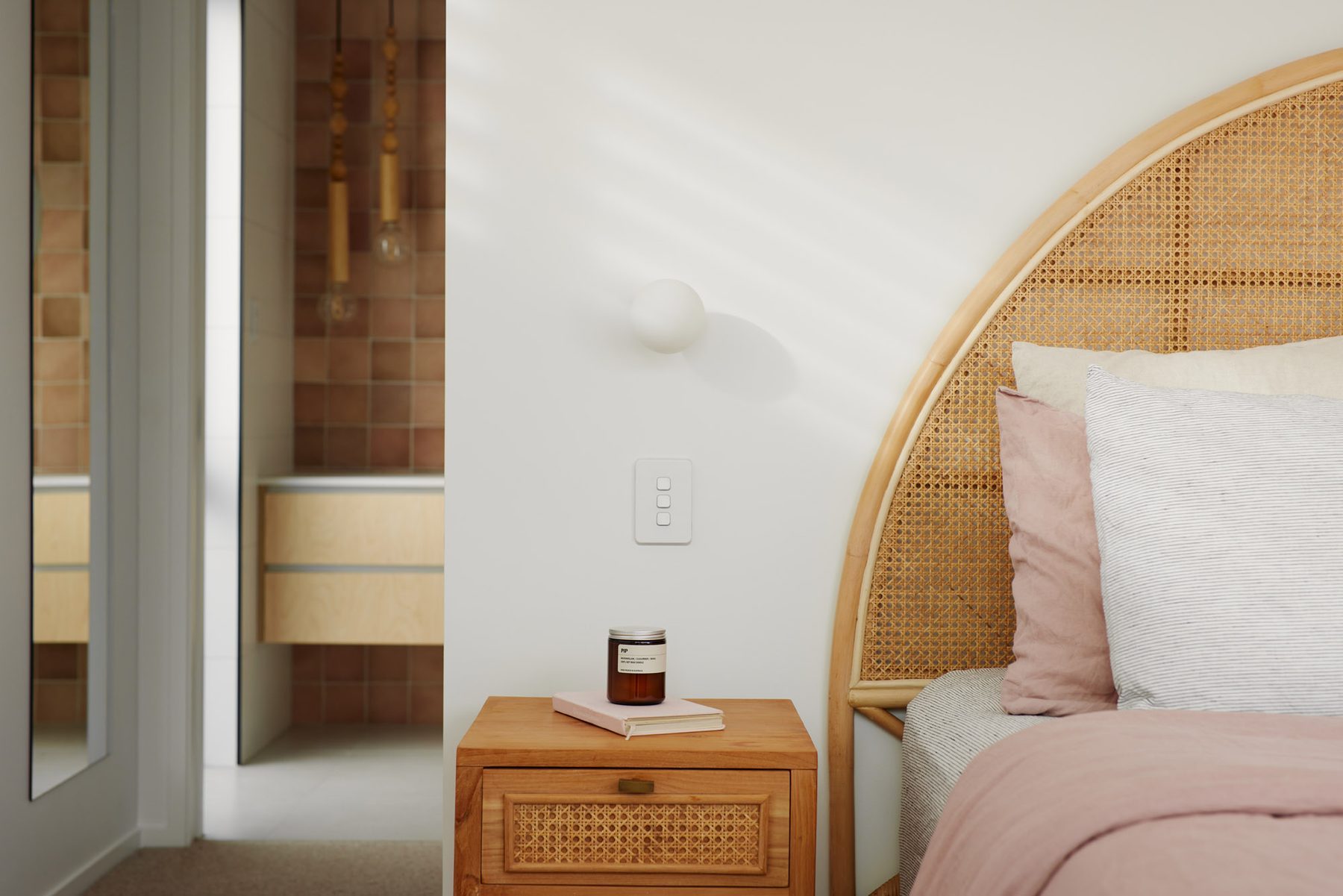 Main bedroom with arched bedhead detail.